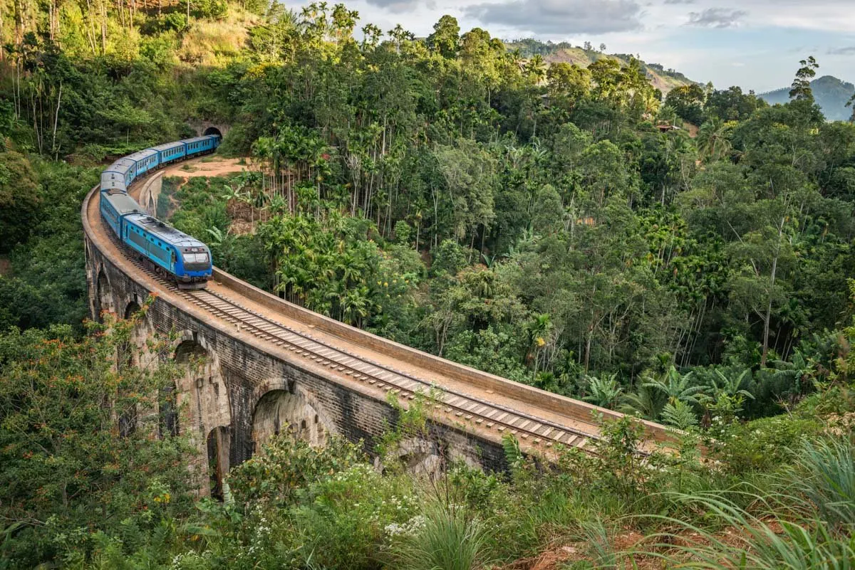 The iconic train winding through the lush green hills of Ella, Sri Lanka