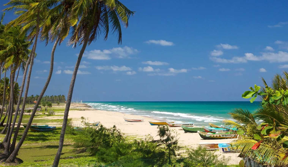 Pristine turquoise waters and golden beach at Trincomalee, Sri Lanka's east coast